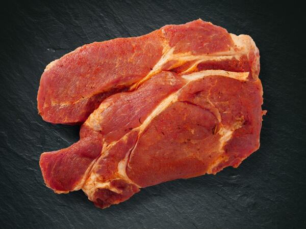 Steaks de cou de porc, assaisonnés
