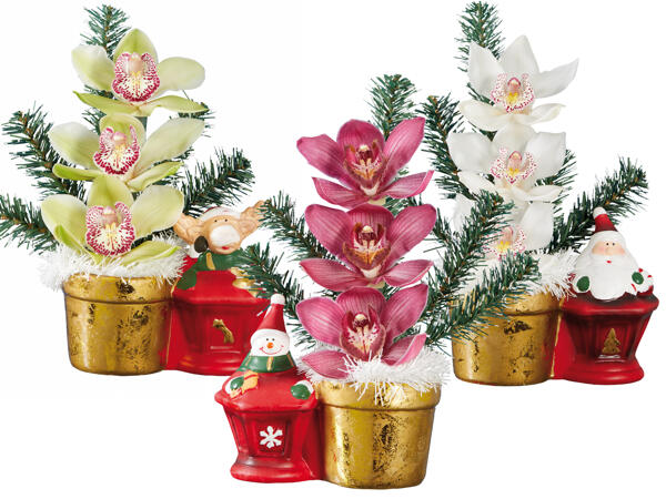 Orchideengesteck mit Weihnachtsfigur