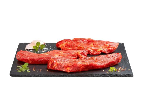 Steak de cou de porc, assaisonné