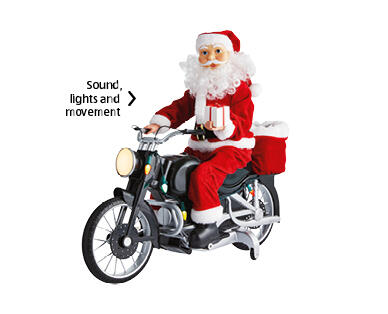 Mr. Christmas Cycling or Motorcycling Santa