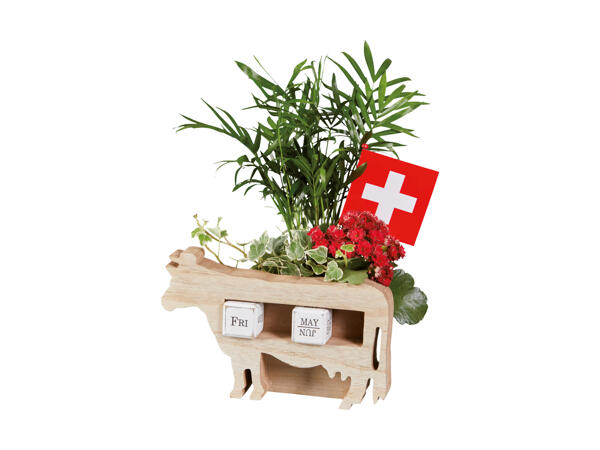 Vache en bois avec plantes pour le 1er août