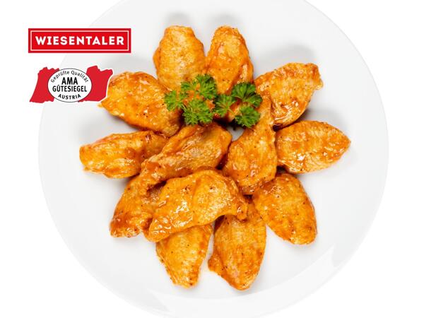 Frische Maishendl Flügerl gewürzt