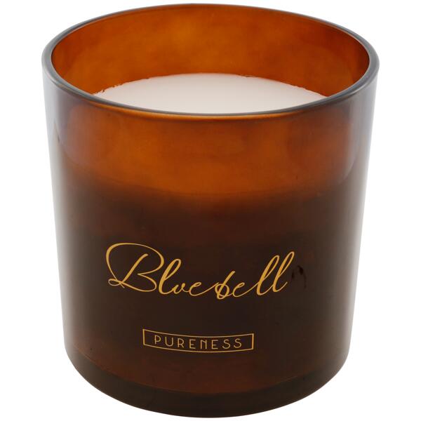 Bougie parfumée dans un verre coloré