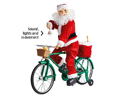 Mr. Christmas Cycling or Motorcycling Santa