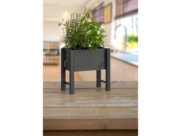 Raised planter box for herbs