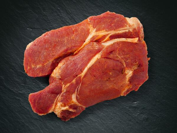 Steak de cou de porc, assaisonné