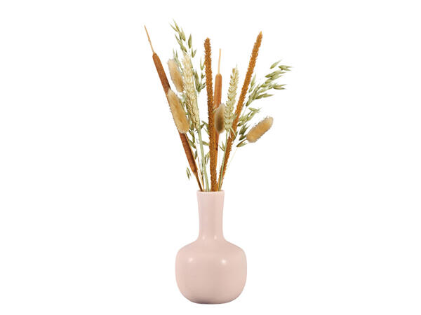 Fleurs séchées dans un vase en céramique pastel